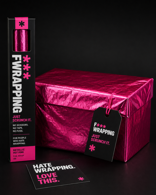 Box-shaped gift wrapped in plain opaque crinkled hot pink foil