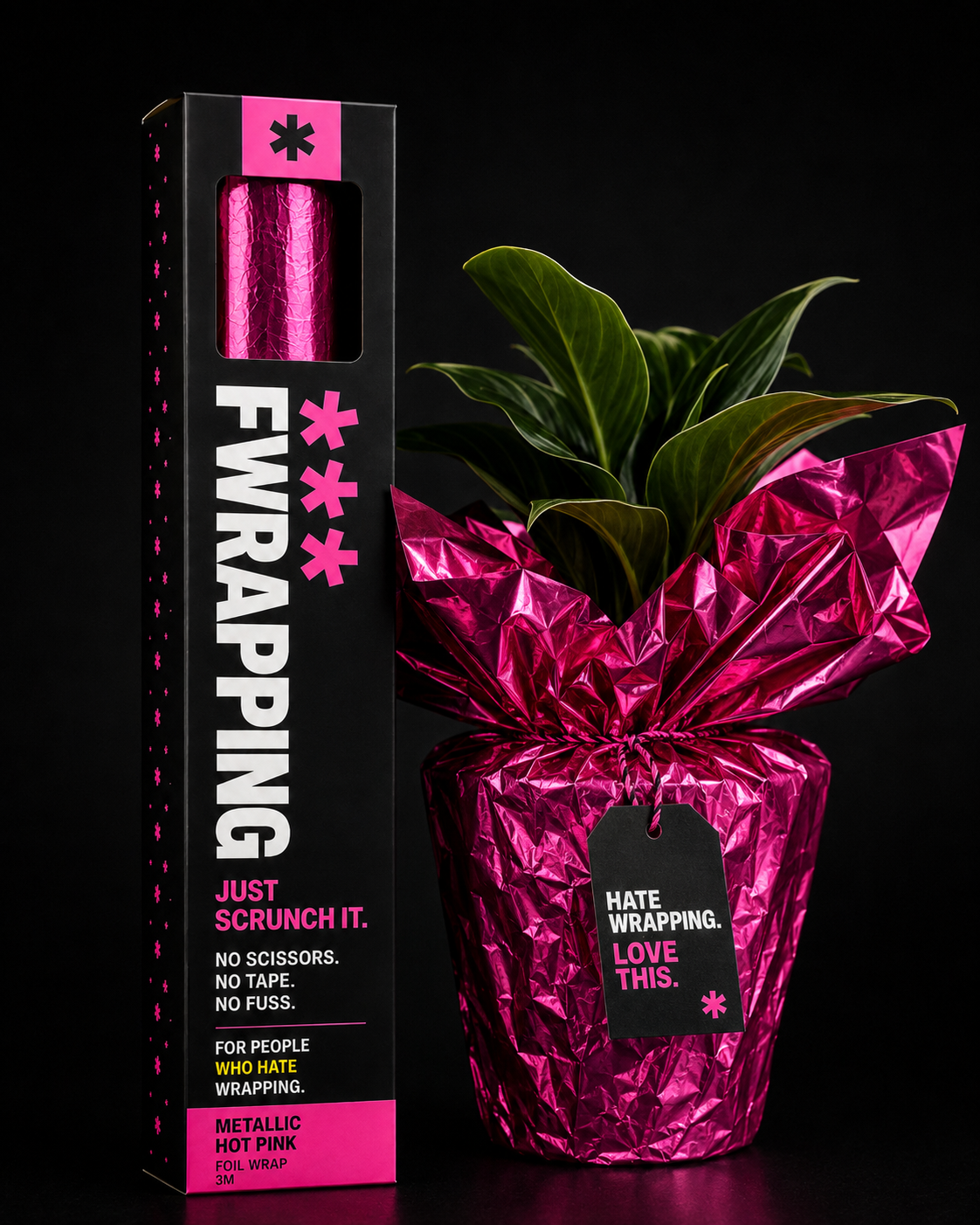 Plant pot wrapped in plain opaque crinkled hot pink foil